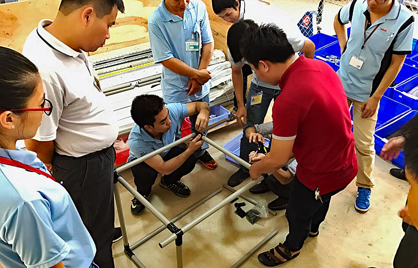 Flexpipe assist to a training while visiting an Adidas Plant in China.