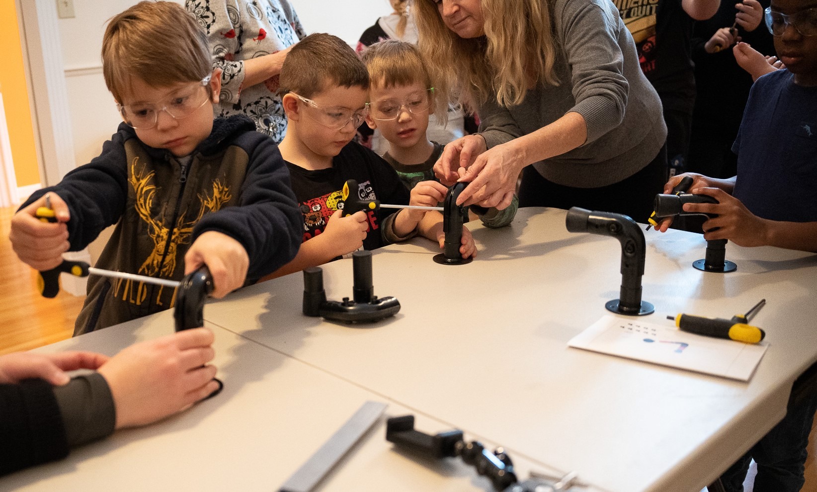 A COAT RACK DESIGNED FOR AND BY THE CHILDREN OF THE LA-LE-LI CENTER