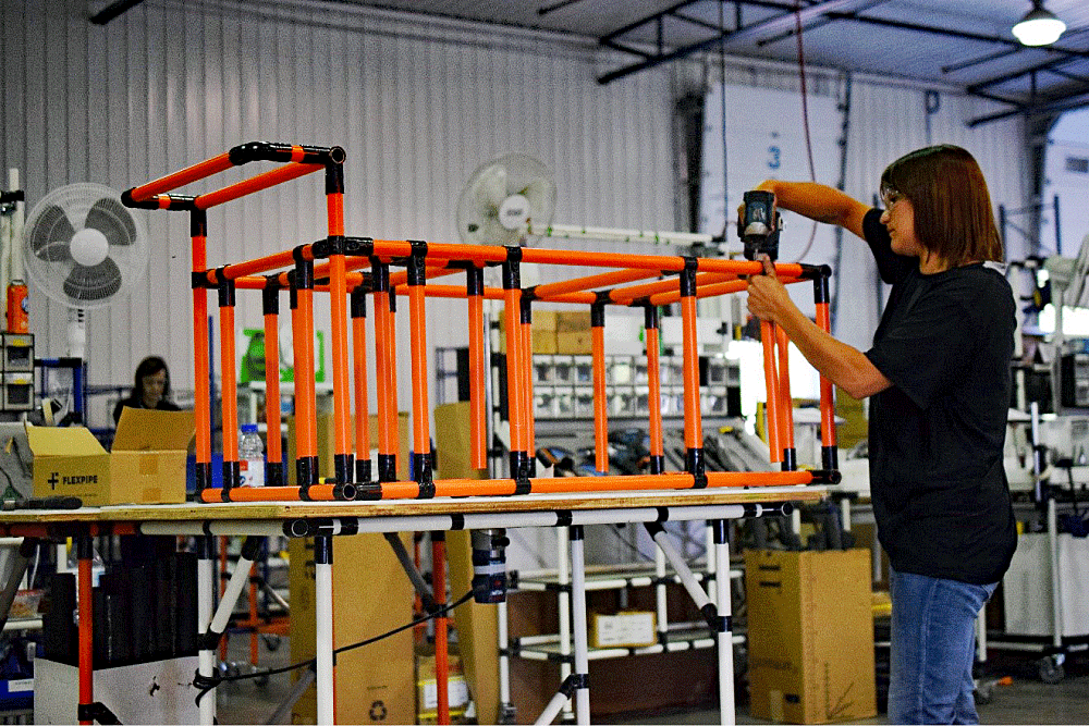 Assembly of the cart designed for a 2,000-pound concrete block is in progress.