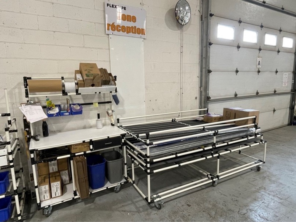 mobile packaging station that includes a customized racking system with a motion mat that has rollers to allow packaged products to slide down to the end of the cart and stay in place to be picked up by the shipping company.