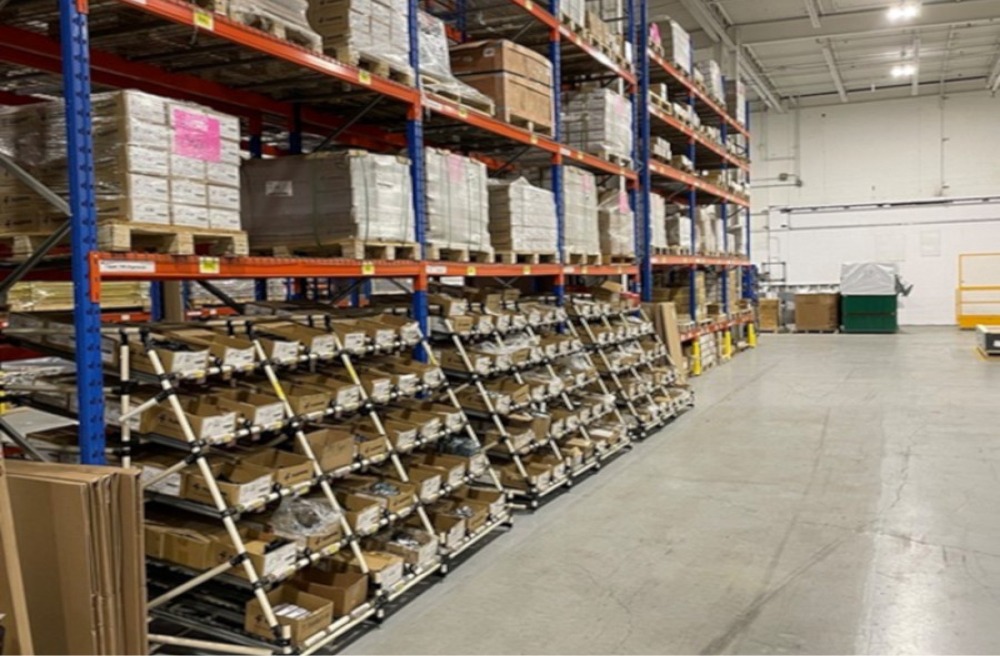 Three-row Flexpipe modular and scalable flow racks. Each rack contains five levels and each level contains multiple bins of fasteners, nuts, bolts, screws, joints, and other consumables.