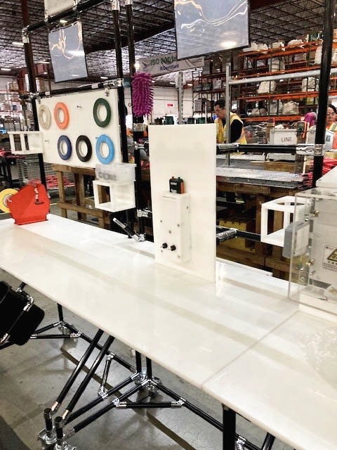 Modular workstation add-ons for the electrical equipment industry, featuring organized storage for tools and electrical components in a 5S environment