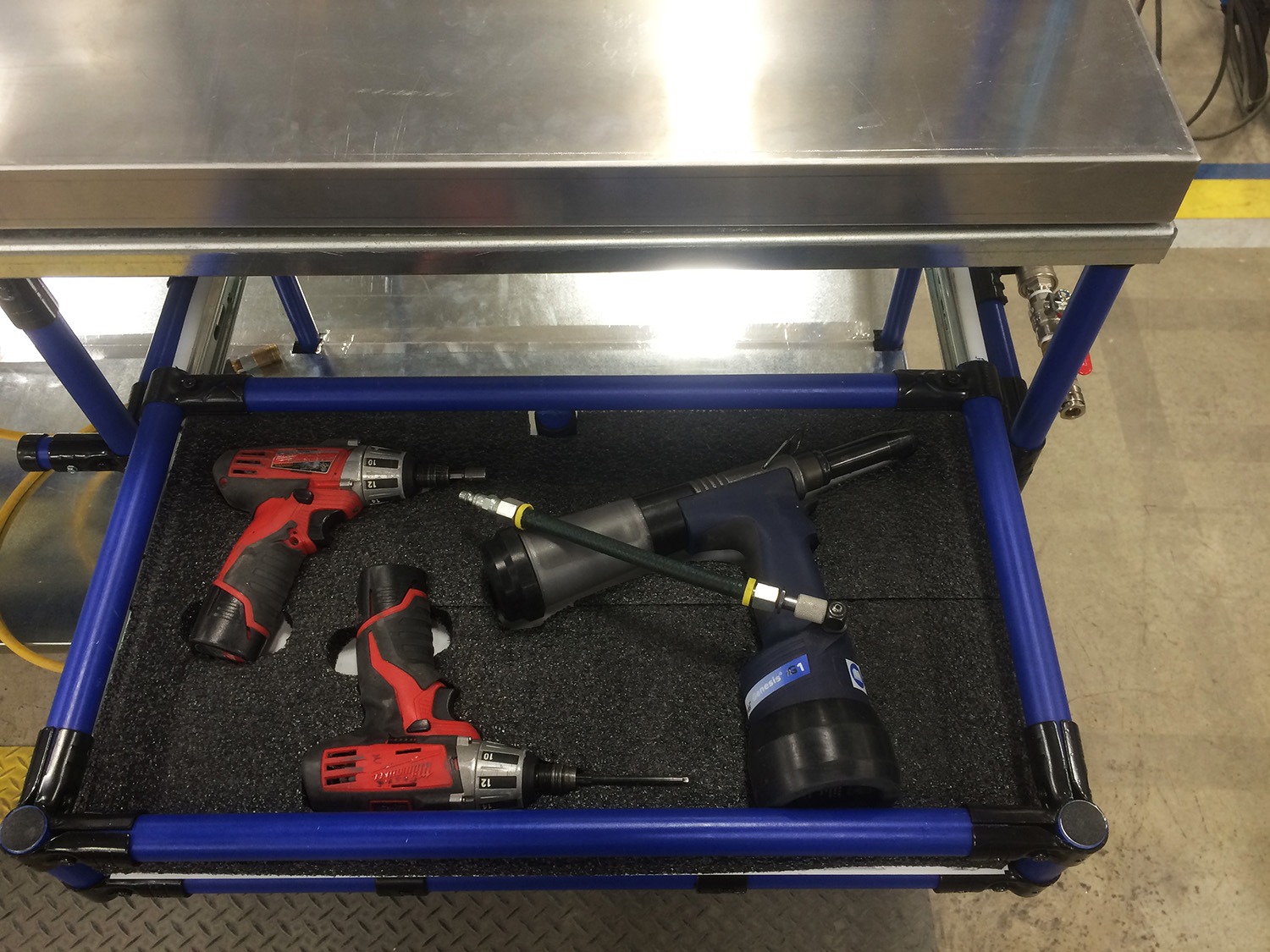 Modular workstation drawer with organized power tools for efficient 5S workspace setup