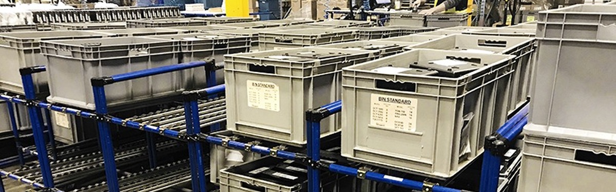 Gravity flow racks used for receiving material in plastic totes