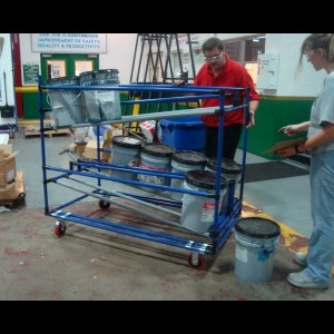 Multi-functional cart equipped with flowracking system, specifically designed for efficiently storing and handling paint bins.