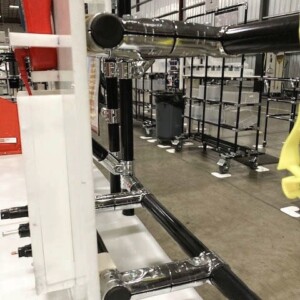 Modular cable management workstation for the electrical equipment industry, featuring organized cable routing and tool storage in a 5S industrial environment